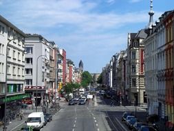 traffic on wide street in city at summer day, germany, cologne