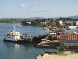 ships in harbor at shoreline, vanuatu