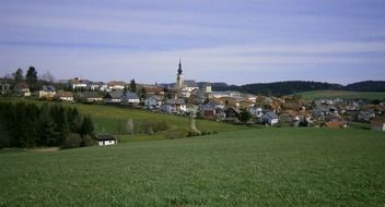 picturesque village among green fields, austria, reichenthal