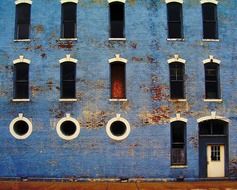 old weathered blue building wall