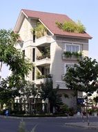 beautiful villa with potted plants on facade