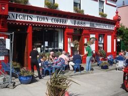 people in scenic open air cafe, ireland, valentia