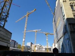 four cranes on the construction site