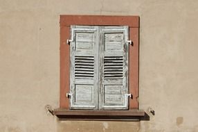 old white windows on a wall