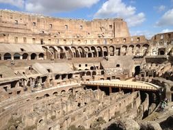 tourists inside colosseum, italy, rome