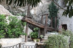 medieval wooden water pump at rock