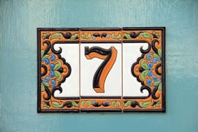 number seven on wall, colorful ornamental tiles