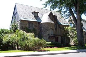 old mansion with tile roof and turret on street, canada, montreal, westmount