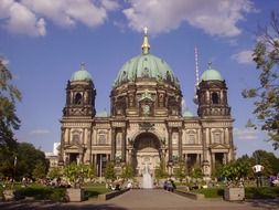 people resting on square in front of dome at summer, germany, berlin