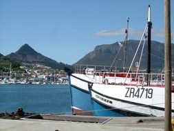 harbour boats in harbor in view of city on mountain side, south africa, cape town