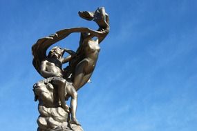 man and woman at sky, bronze sculpture