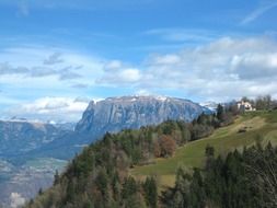 mountains, forests against the backdrop of clouds in South Tyrol