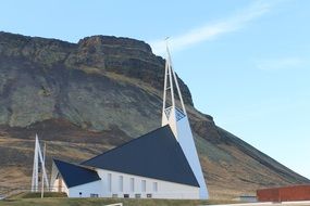 unusual modern church building at mountain, iceland, Ólafsvík