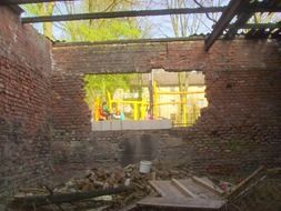 hole in brick wall, destruction of old building