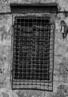 black bars on a window on a wall