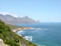 picturesque rocky coast at blue ocean, south africa, cape town