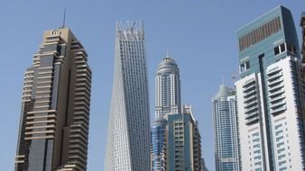 The Marina Torch among skyscrapers at sky, uae, dubai