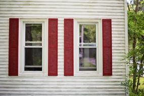 red shutters white wooden facade house