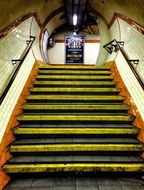 ascending stairway with railing indoor