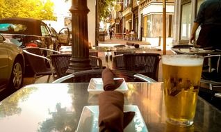 beer in glass on table of open air cafe, usa, pennsylvania, philadelphia