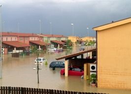 flooded village under stormy clouds, italy, sicily, sigonella