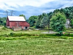 red farm building in rural summer landscape, usa, pennsylvania