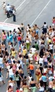 protest in city, crowd of black and white people walking on road