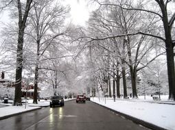 traffic on wet road at snowy winter, usa, West Virginia, huntington