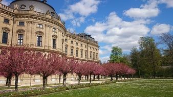 Würzburg Residence, baroque palace in garden with colorful plants at spring, germany