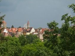 old city behind trees at summer, germany, Rothenburg ob der Tauber