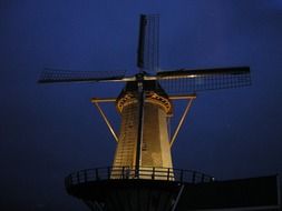illuminated windmill at night sky, netherlands