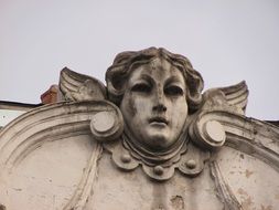 cupid, aged relief on facade, romania, transylvania, cluj napoca