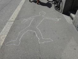 male silhouette, chalk drawing on road