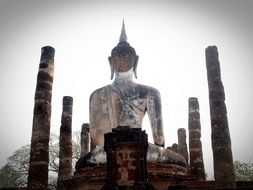 back view of Sitting Buddha and brick columns, Thailand, Sukhotai