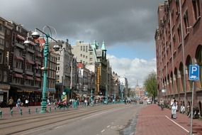 street with railway in old city, netherlands, amsterdam