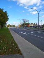 traffic signs on asphalt road in city