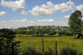 distant town in countryside, summer landscape, poland, jelenia góra