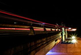 lights on side of road bridge at night city, usa, california, sacramento