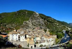scenic old town on mountain side at river, france, entrevaux
