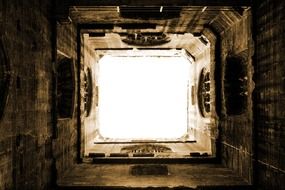 well in tower of medieval abbey, bottom view