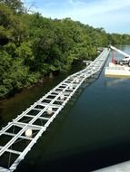 white bridge over the lake