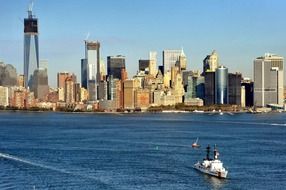 coast guard ship on water at city skyline, usa, nyc