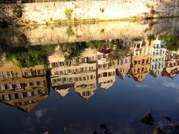 reflections in the water of the university town