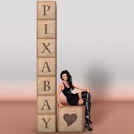 sexy woman sitting at pixabay lettering