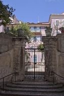 closed wrought iron gates of old villa, italy, sanremo