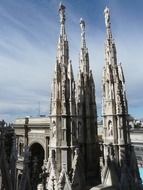 Side view on the spiers of the cathedral in Milan