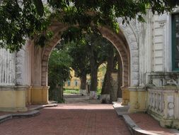 french architecture, arched gateway to courtyard, vietnam, hanoi