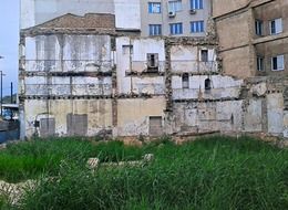 walls of demolished buiding in city, greece, athens