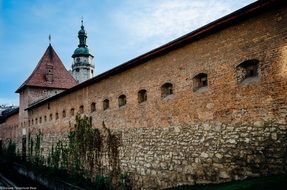 perspective of medieval stone wall with tower, ukraine, lviv