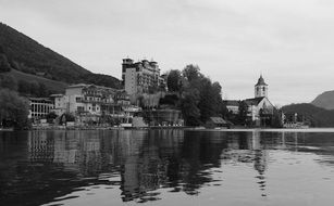 mirroring water of a lake in black and white